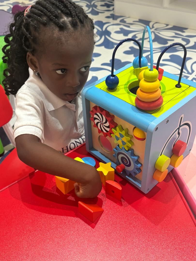 Young children exploring safe play-based learning materials