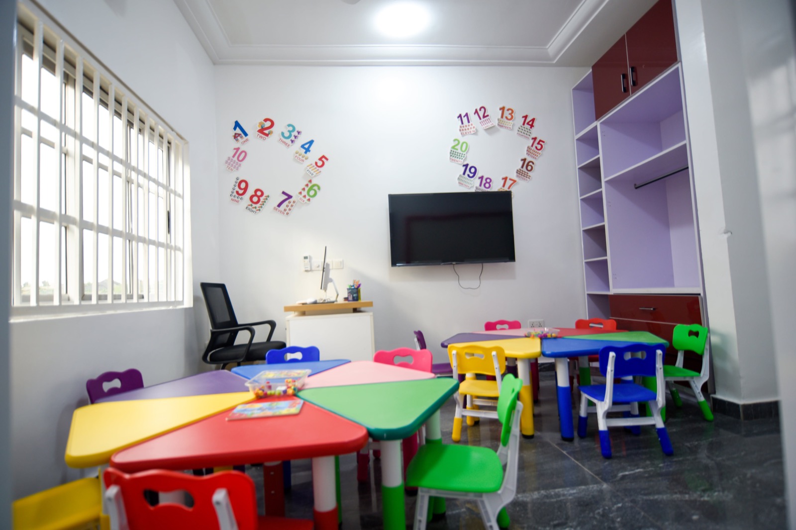 Bright HoneyBerry classroom with colourful child-sized tables